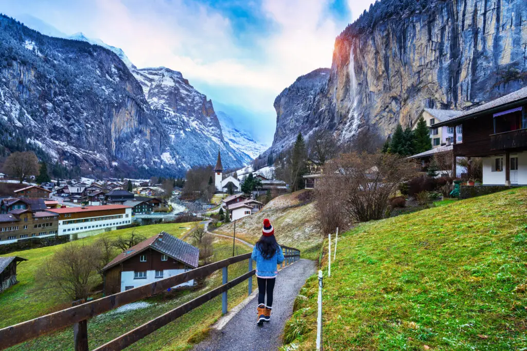 Tourist visiting village of Lauterbrunnen in the Bernese Oberland, Switzerland.